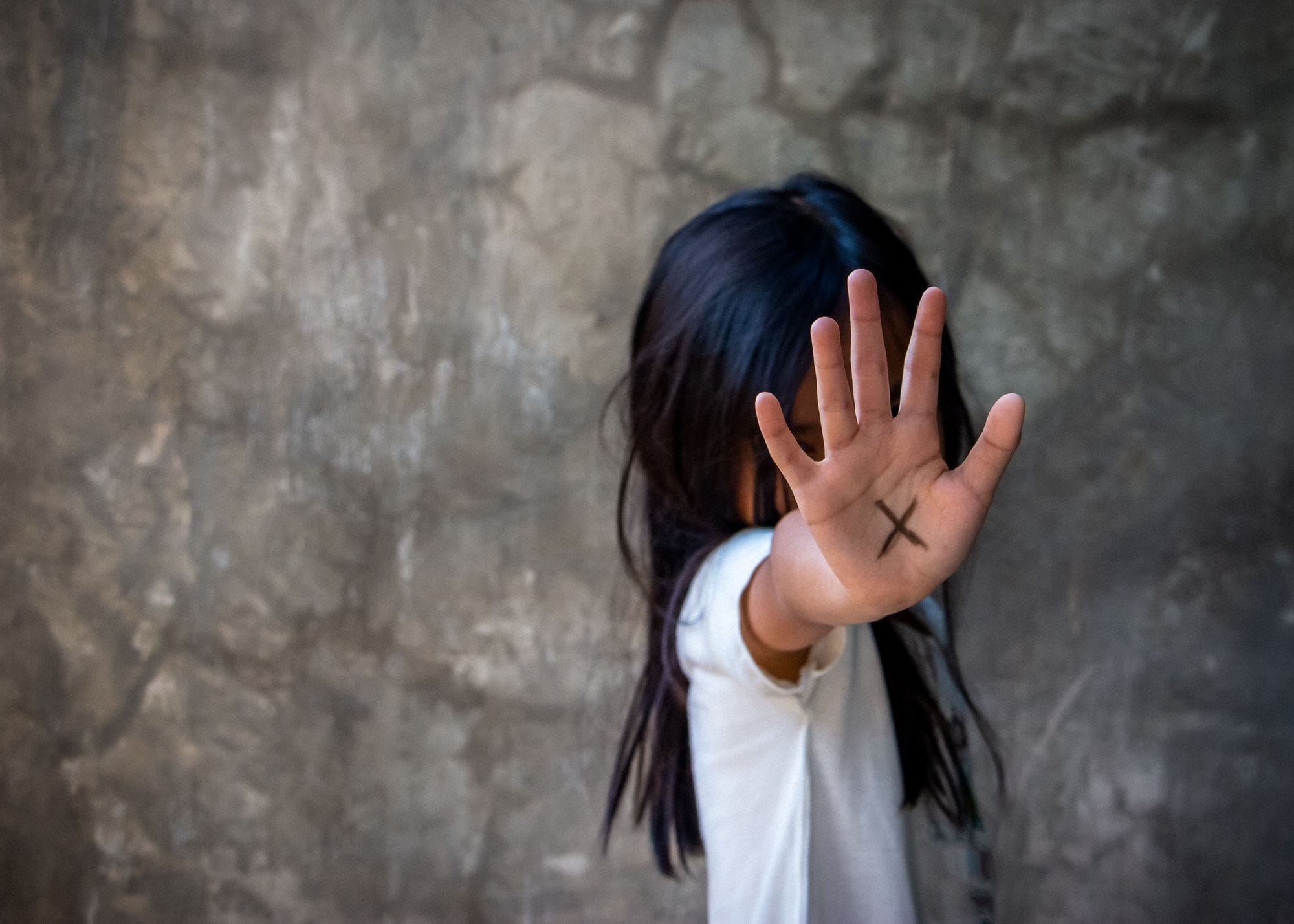 Young Girl Covering Her Face With Her Hands