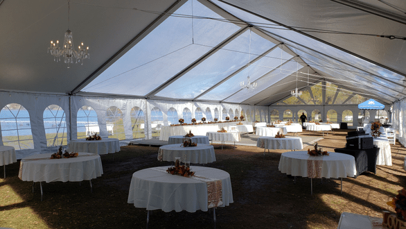 Tent wedding lighting. Perimeter bistro with four chandeliers. Tent lighting by Duluth Event Lighting.