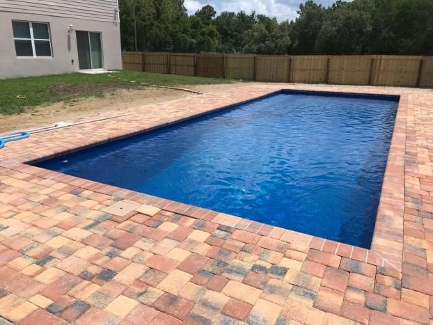 Pasco and Hernando County Fiberglass Pool Installation By Trinity Pools, Inc. located in Spring Hill, FL.