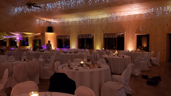 Northern Pines Golf Center in Iron River, WI. Wedding lighting in a dim warm white and a soft peach by Duluth Event Lighting.