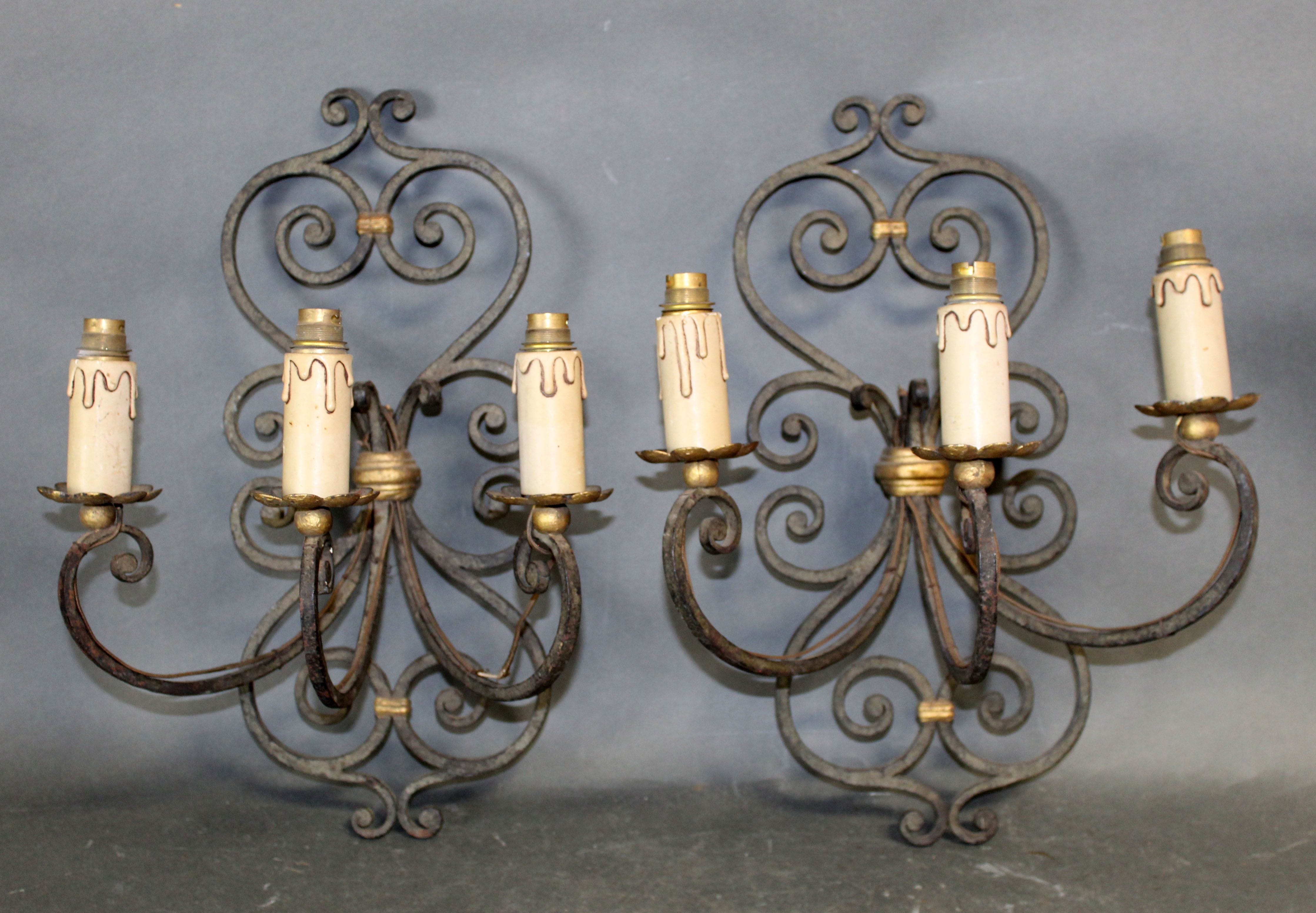 Pair of French scrolled iron wall sconces