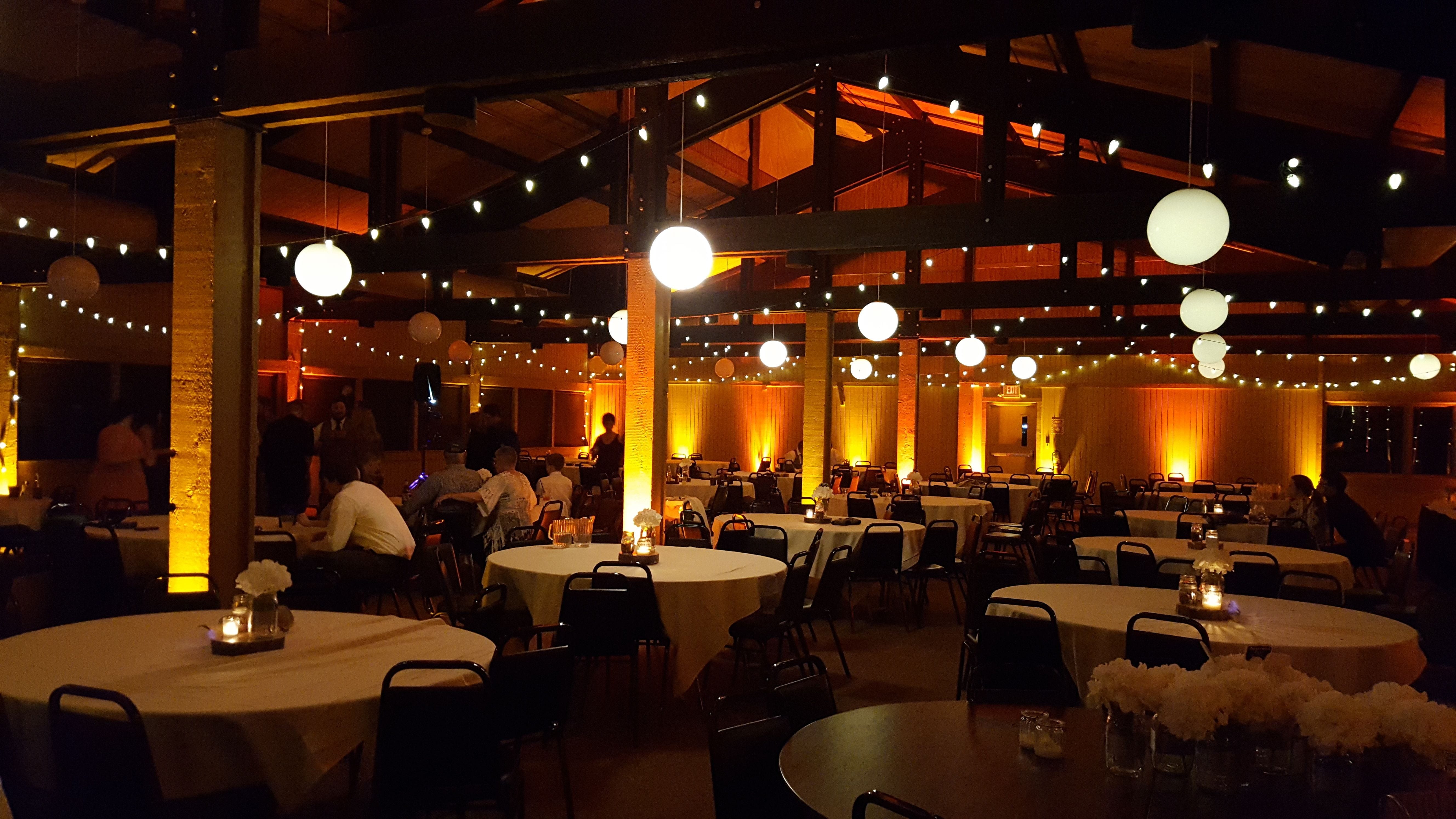 Wedding lighting in the Bear Paw Room at Spirit Mountain. Up lighting in amber with bistro.