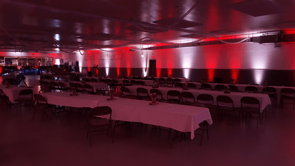 Up lighting in red and soft white for a wedding at the Superior Curling Club.