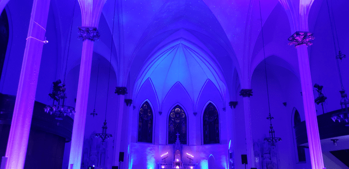 Sacred Heart Music Center,
blue and purple up lighting for a wedding.