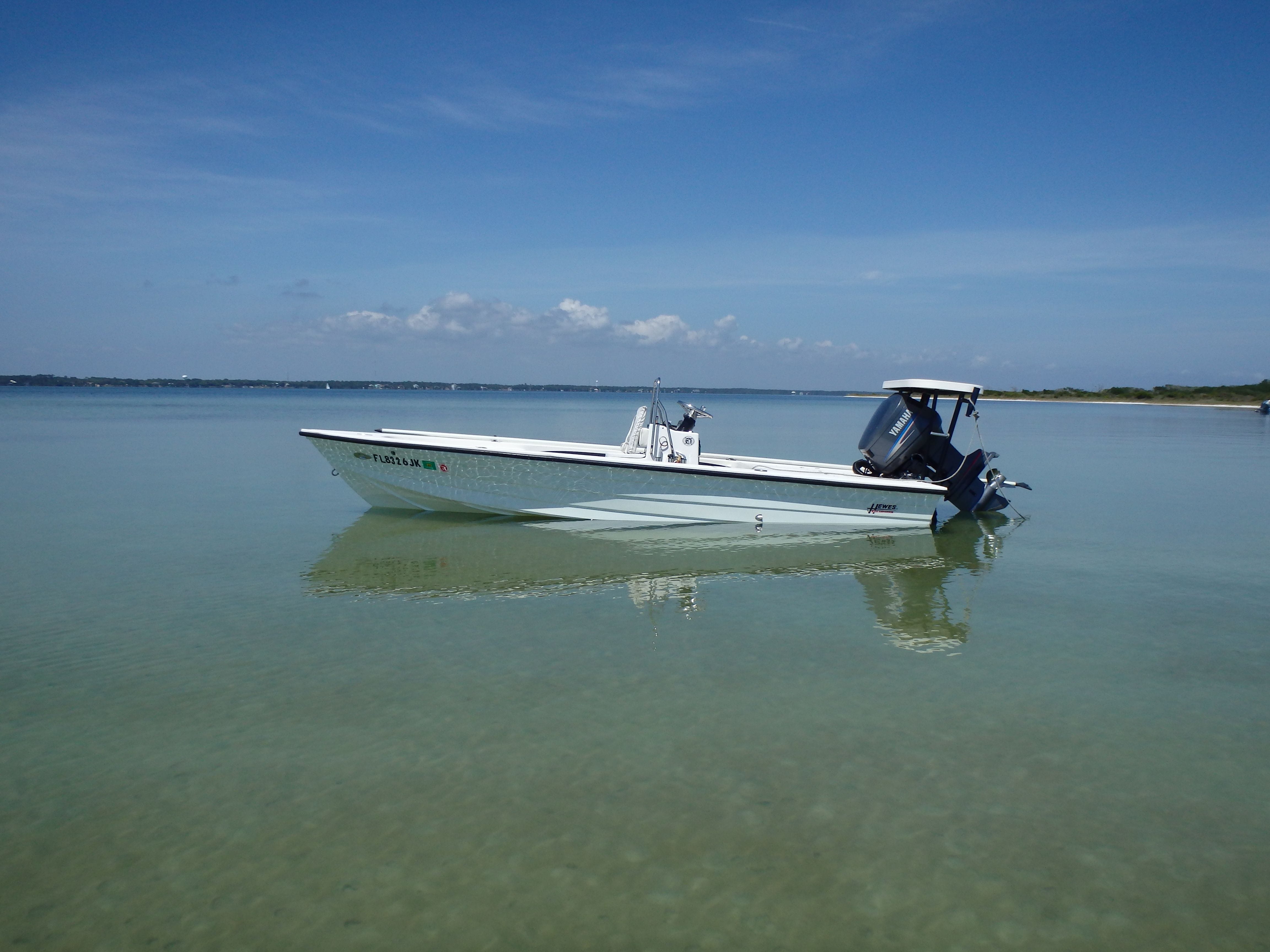 Hewes redfisher 18 flats boat in calm shallow water