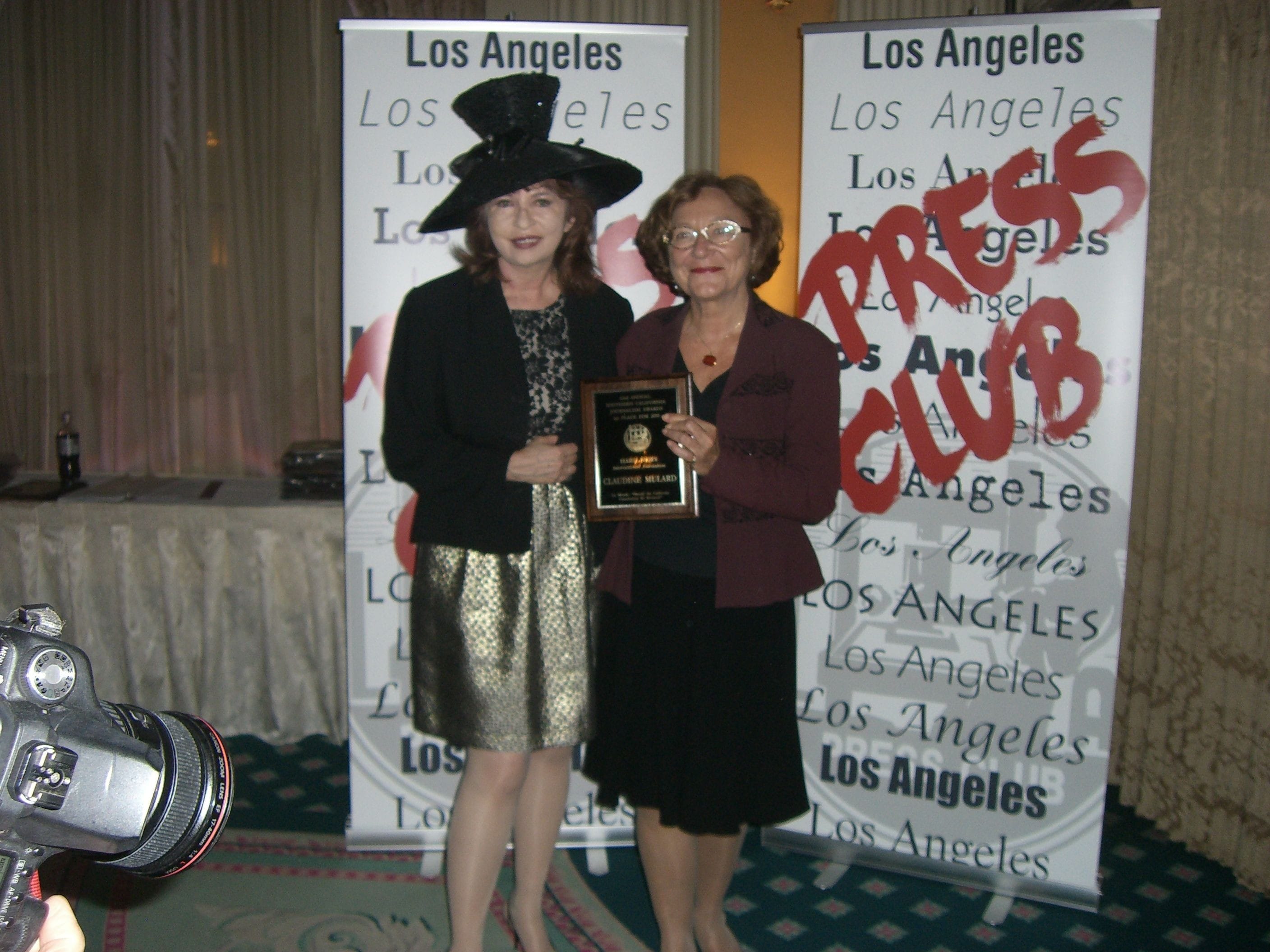 Claudine Mulard receiving her award from Patt Morrisson.