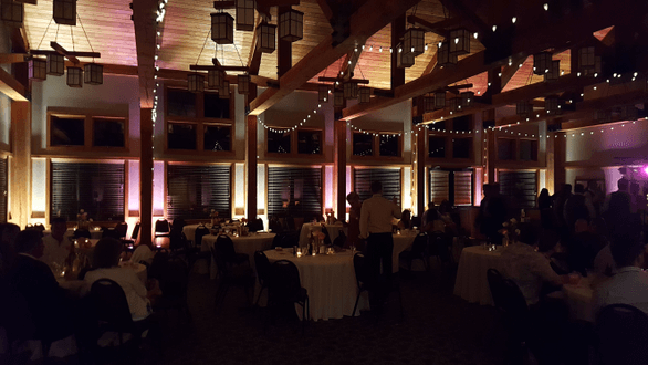 Heartwood Event Center in Trego, main dining room.Wedding lighting in pink andwarm white. Bistro