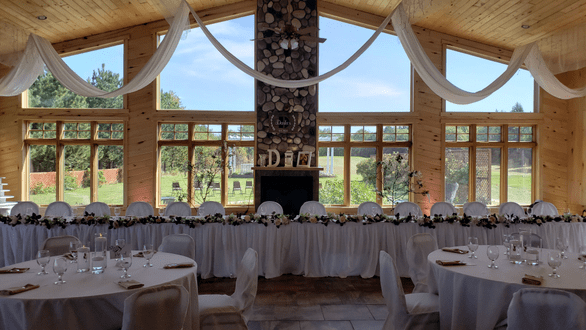 Northern Pines Golf Center wedding lighting in a soft peach and dim warm white. Lighting by Duluth Event Lighting.