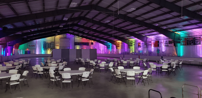 Wedding lighting in a color changing rainbow for a wedding in the Four Seasons Sports Complex in Carlton.