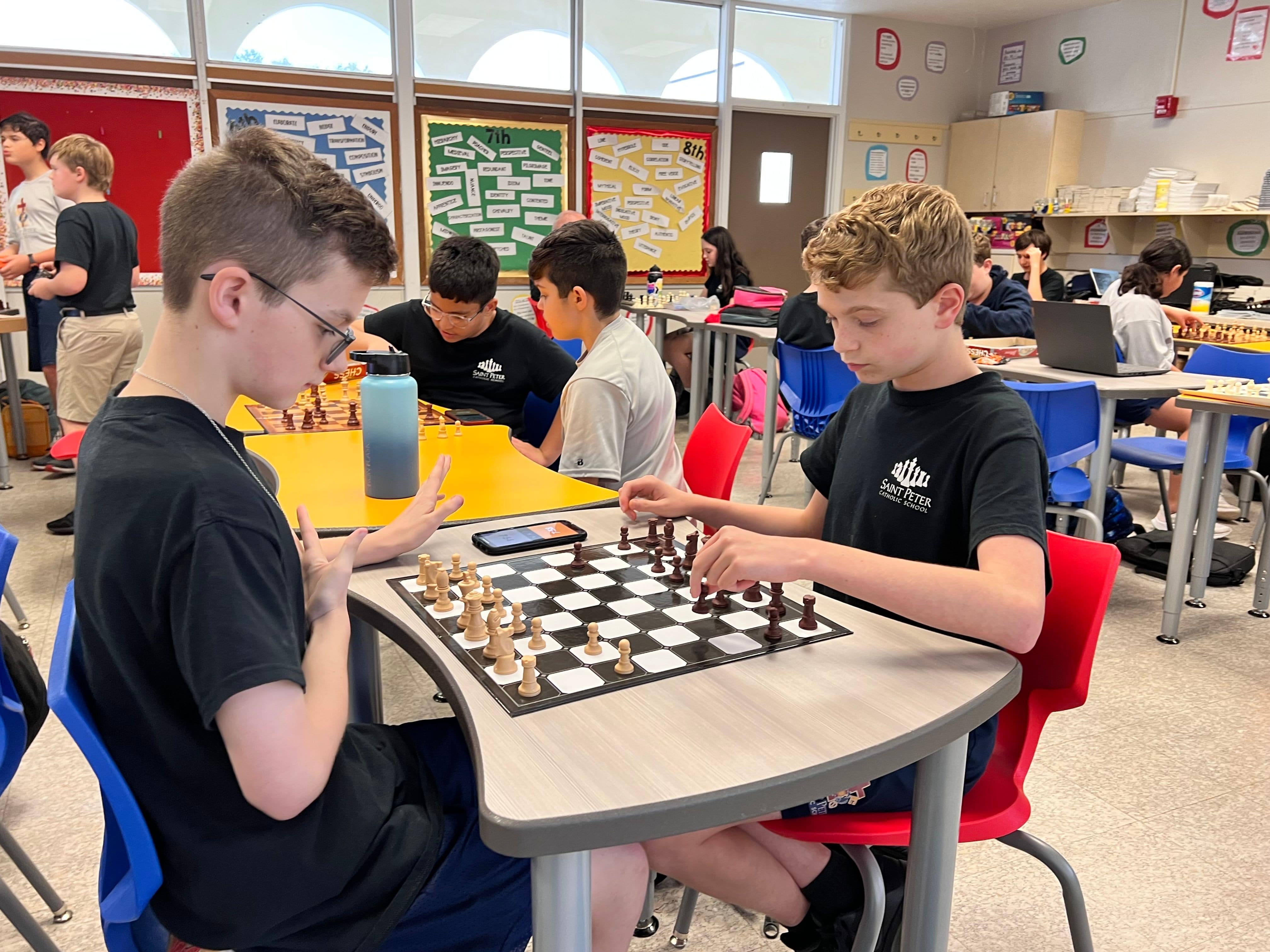 Students are learning the game of chess.