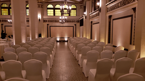 Wedding ceremony lighting in the Moorish Room. Up lighting in a soft gold and a soft white.