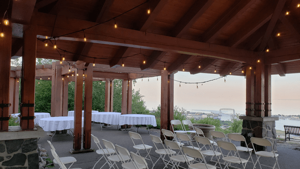 Outdoor bistro by Duluth Event Lighting for a sunset wedding at Enger Park.