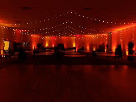 Fall color theme wedding at the AAD Shrine withred and orangeup lighting. bistro