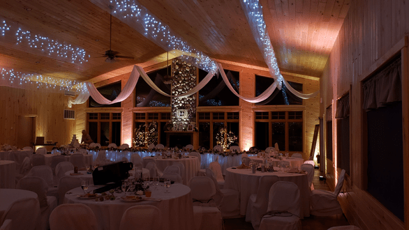 Northern Pines Golf Center wedding lighting in a soft peach and dim warm white. Lighting by Duluth Event Lighting.