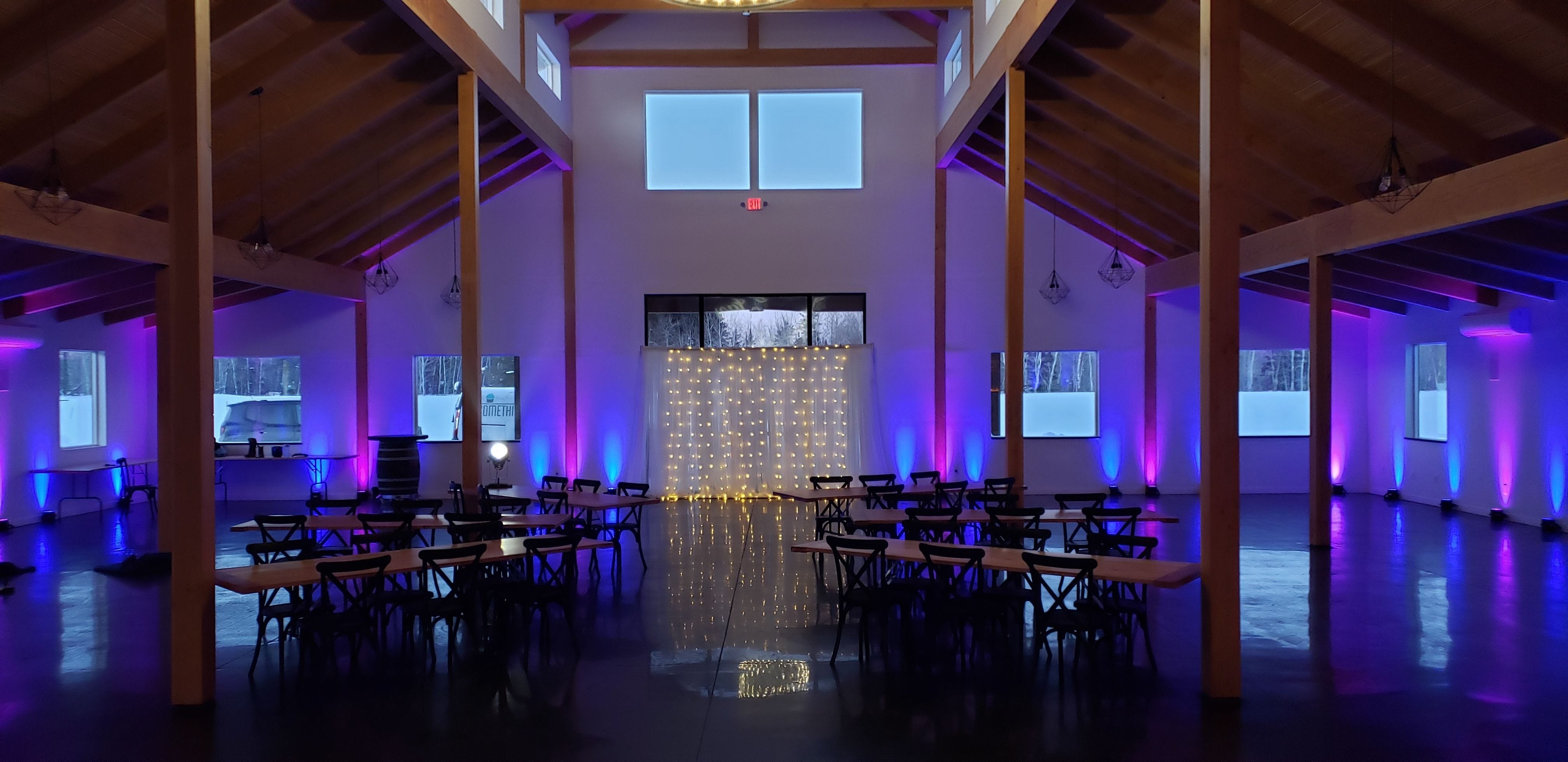 Wedding lighting at Ivy Black in blue and purple up lighting by Duluth Event Lighting.
