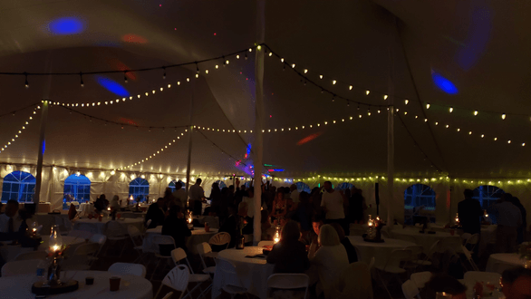 Tent wedding lighting. Bistro. A darkened tent with the brighter set of bistro turned off.