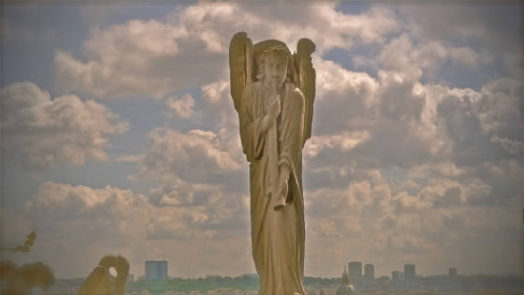 Photograph of Angel atop Notre Dame Cathedral, Paris.