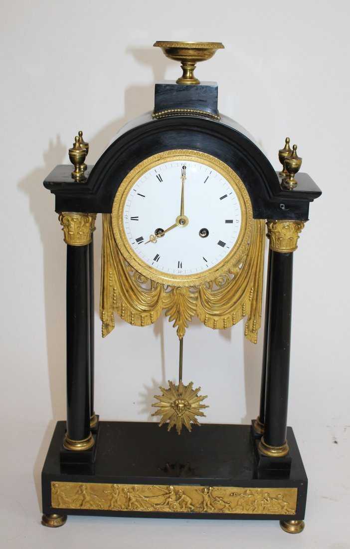 French Empire portico clock in marble & gilt bronze. Early 19th century.