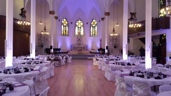 Sacred Heart Music Center,
Lavender purple up lighting for a wedding.