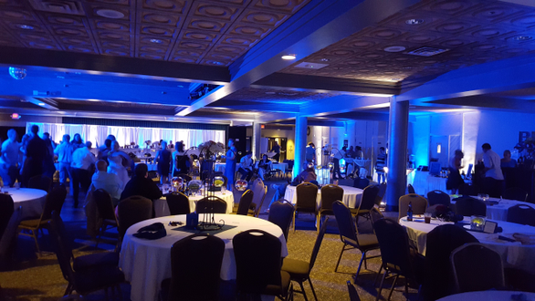 A wedding in Kirby Ballroom at UMD. Up lighting in blue and white.