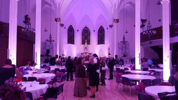 Sacred Heart Music Center,
Lavender purple up lighting for a wedding.