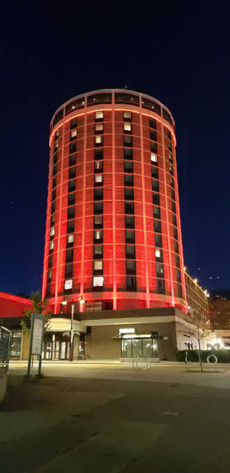 The Duluth Radisson building lit in red by Duluth Event Lighting.