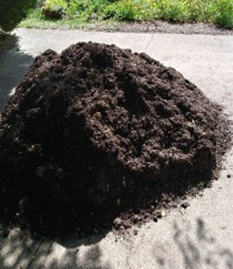 What is left of a huge pile of rich dark compost sitting in the drive way