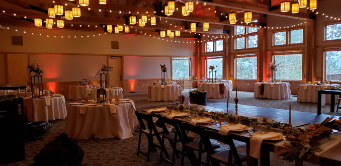 Heartwood Event Center in Trego. Wedding lighting in fall colors.