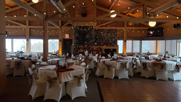 Wedding in the Moose Head room at Spirit Mt. Up lighting in amber with bistro.