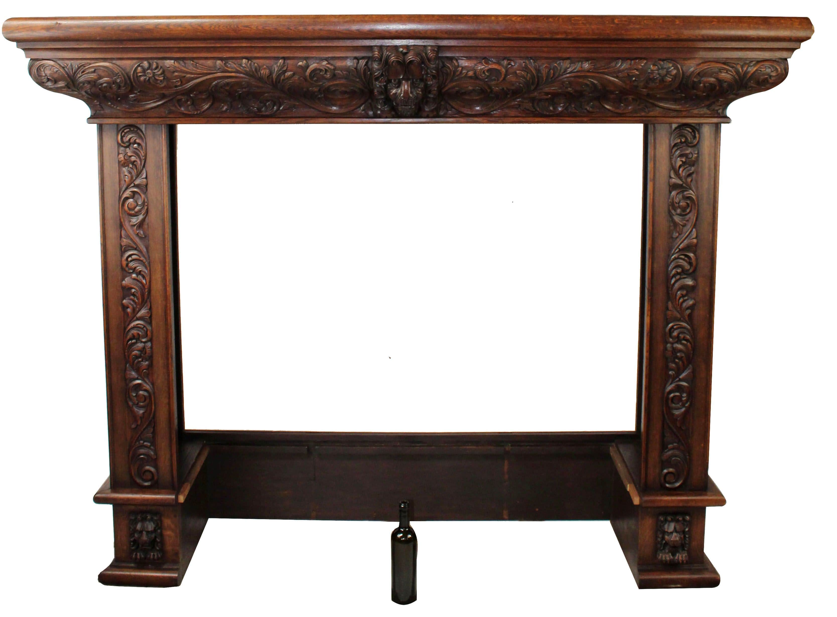 French carved oak mantel with lion mask