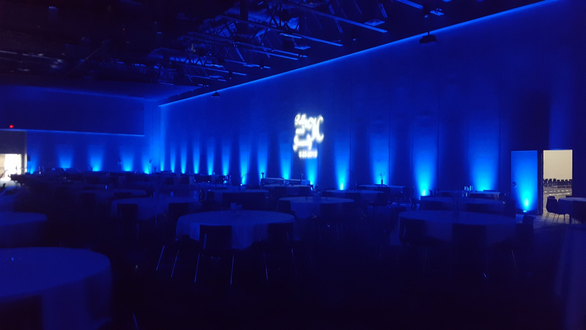 Blue up lighting with a monogram for a wedding at Black Bear Casino.