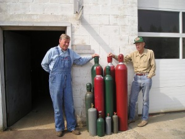 People Standing Near Oxygen Cylinders