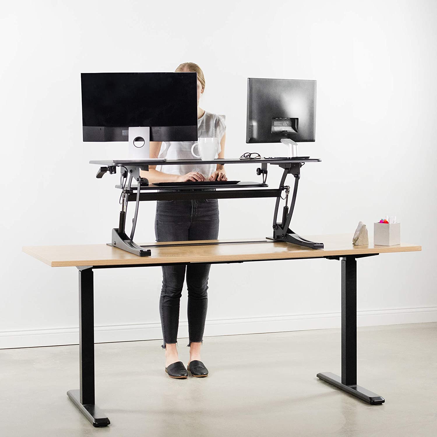 Vivo Height Adjustable Stand Up Desk om a desk
