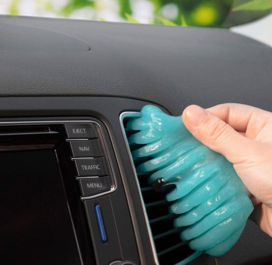 TICARVE Cleaning Gel To Remove Dirt And Dust being applied to an interior car vent