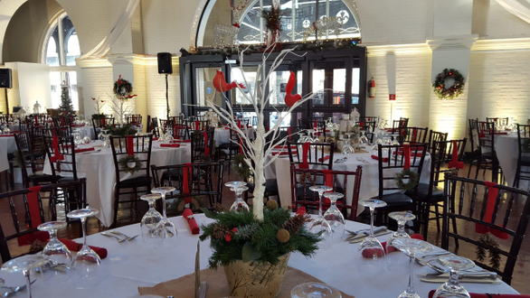 A Christmas theme wedding with soft white up lighting at the Depot.