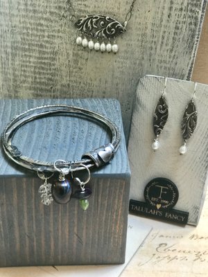 Necklace, Bracelet, Earrings On Display
