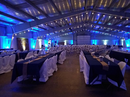 up lighting for a wedding at the Lake County Fairgrounds in Two Harbors in blue and white with bistro. Lighting by Duluth Event Lighting.