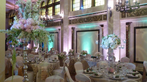 Moorish Room wedding. Up lighting in mint green and peach with pin spots on flowers. gobo pattern on wall.