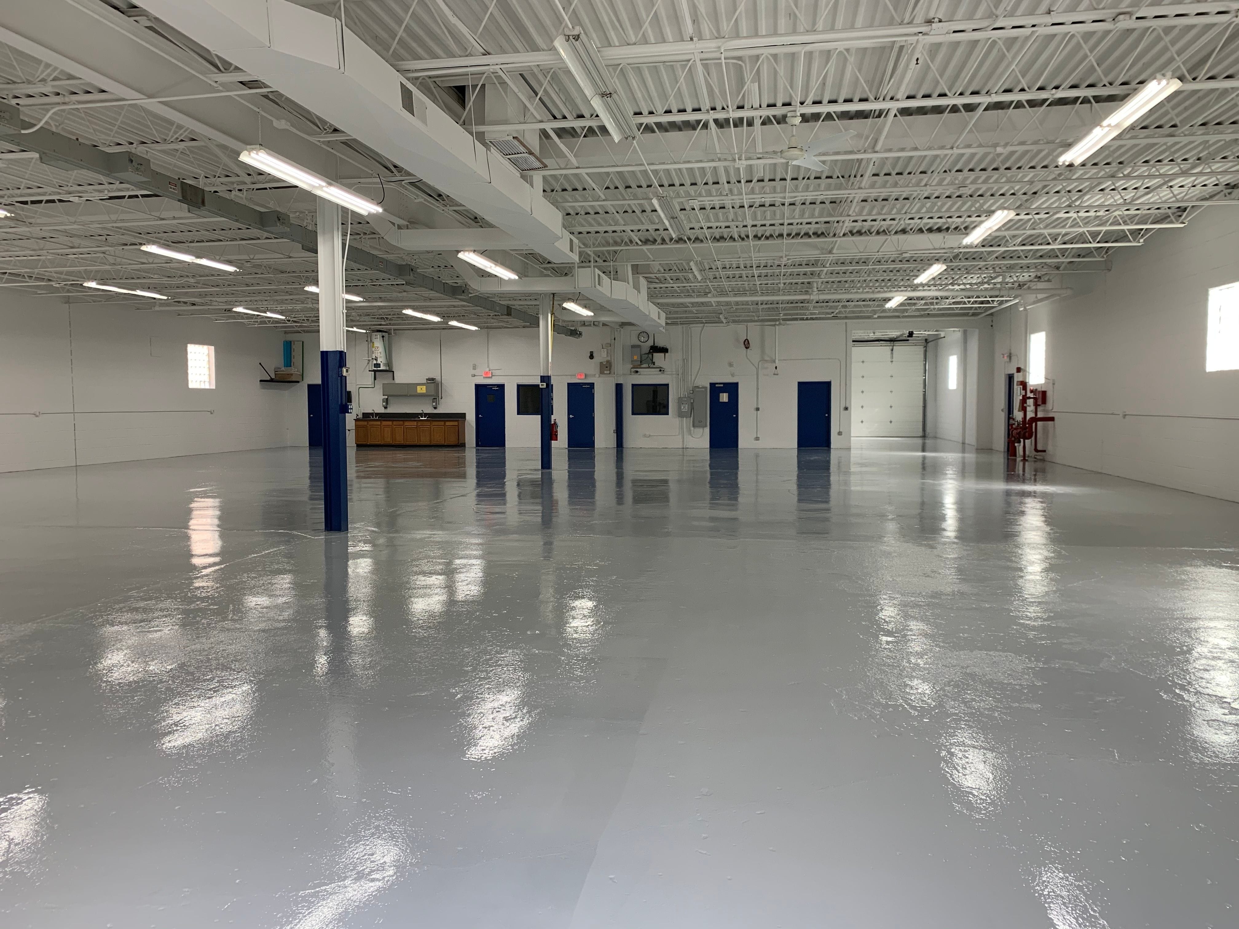 This is a grey epoxy coating in a machine shop. 