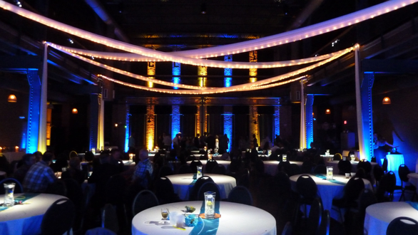 Wedding lighting at Clyde with pin spots on the tables.
