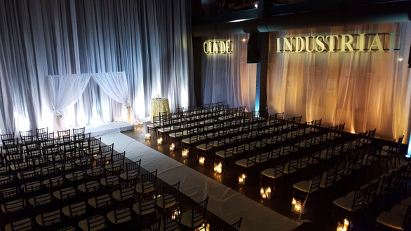 Clyde Iron works wedding with draping lit by Duluth Event Lighting.