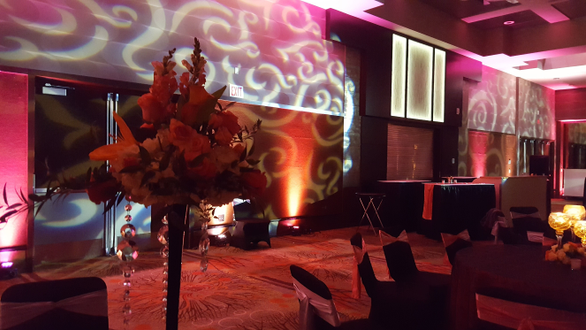 DECC, Lake Superior Ballroom wedding. Up lighitng in pink and red with gobo pattern on the walls.