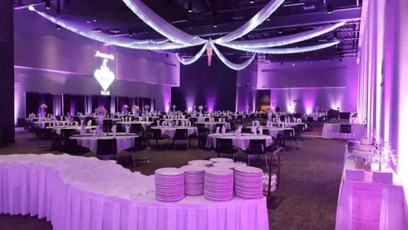 Wedding at Black Bear Casino with two tone lavender up lighting. Ceiling by NSE.