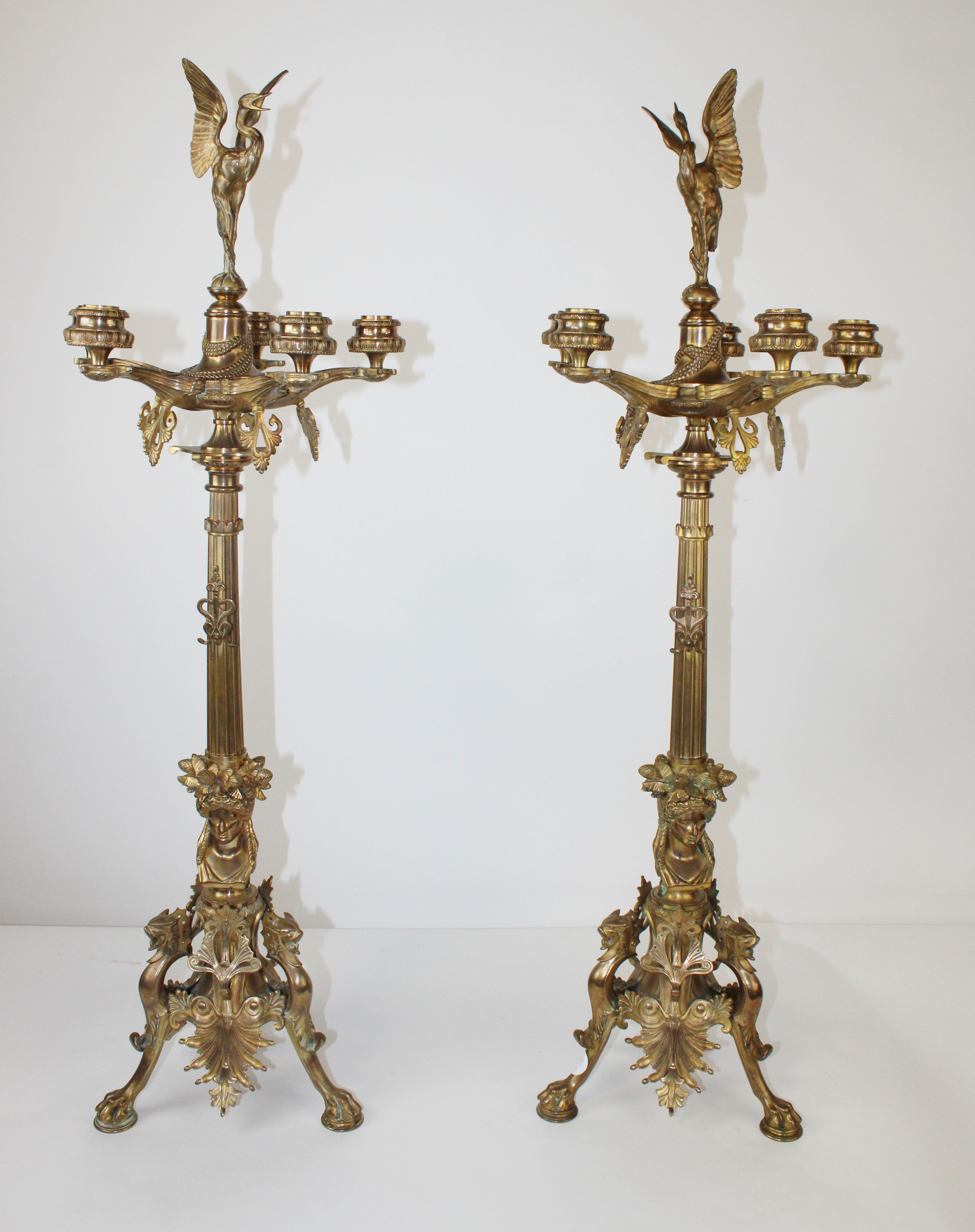 Pair French Empire Barbedienne bronze candelabra. Each having a figural sphinx supporting a fluted column and giving rise to 5 arms and surmounted with a crane.