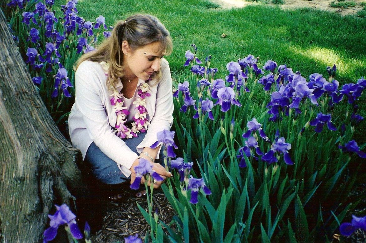 Photo of Elizabeth Bowers at Earlham College in iris garden.