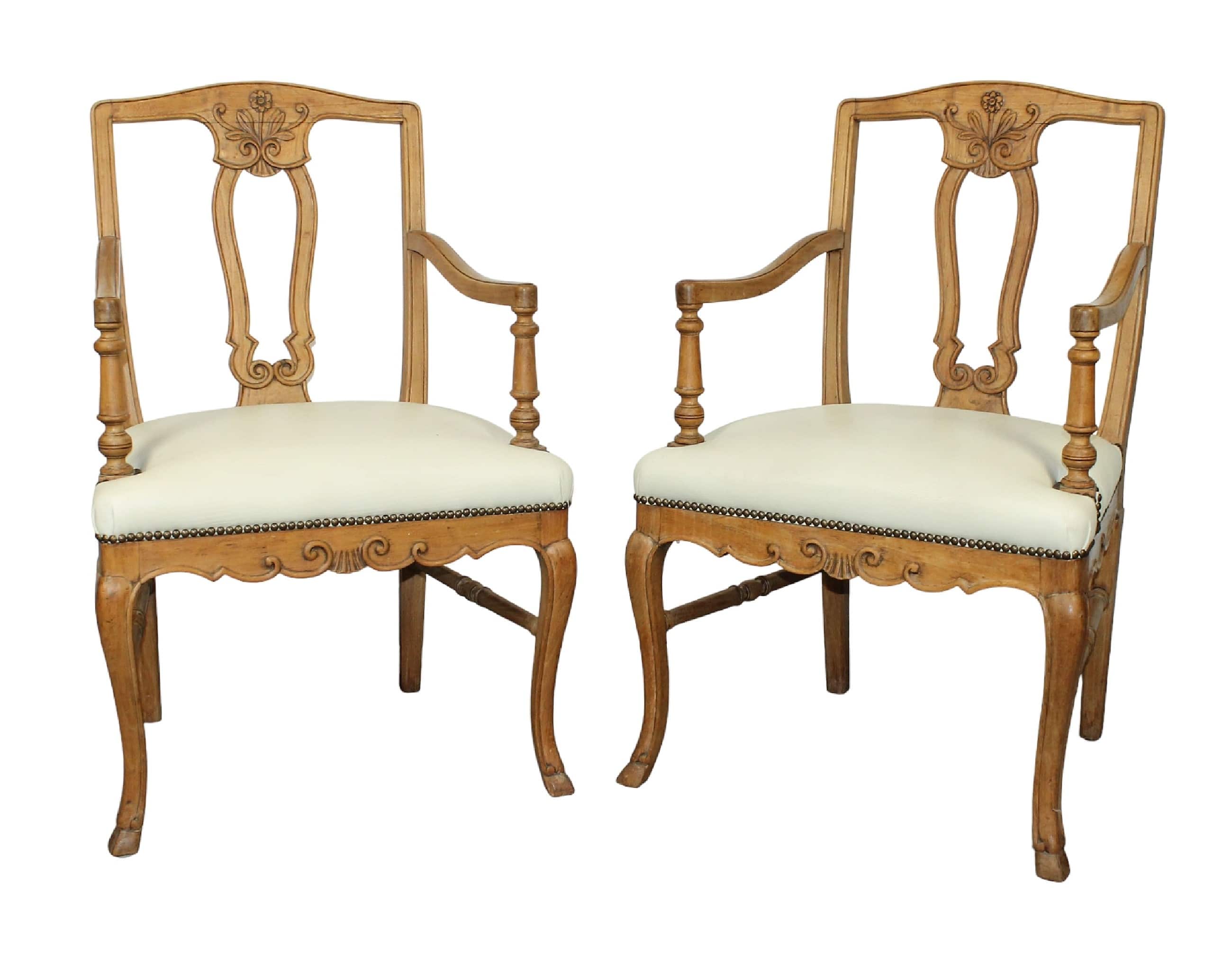 Pair of French Provincial armchairs in oak with leather seats
