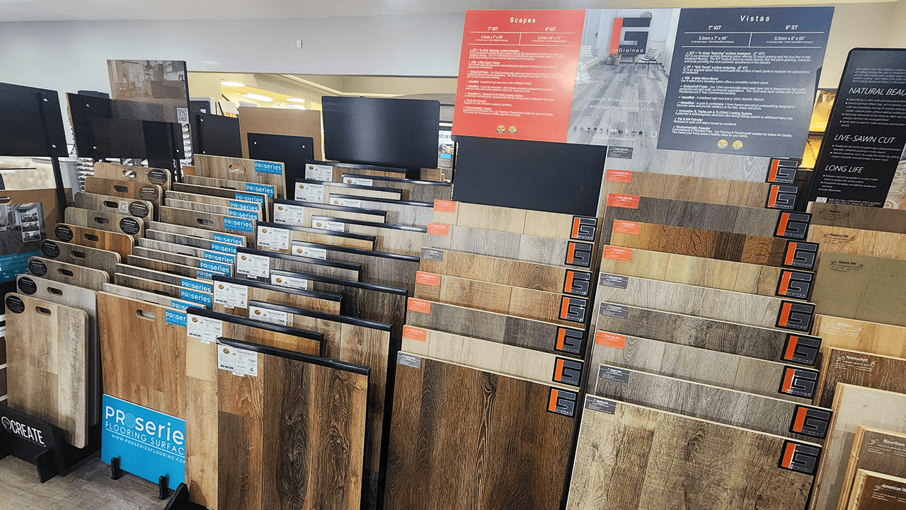 A mix of vinyl plank flooring product in wood facade finishes from a variety of brands like Create Flooring, InGrained from Bella Citta, ProSeries, & more