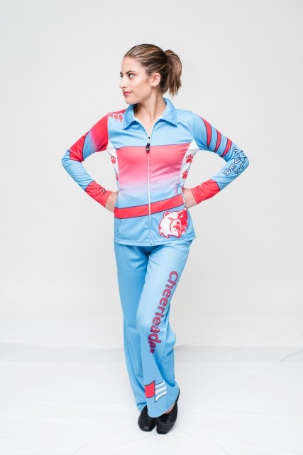 Custom Sublimated Cheer apparel.  Fold -over collar Jacket with Pants. Blue with Red Accents. Cheer text on Leg and arms, Bear Graphic on jacket.