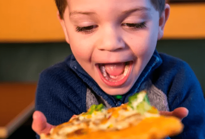 Boy Enjoying Pizza