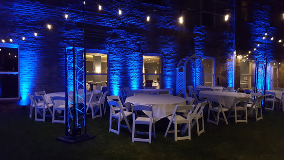 Wedding lighting at the Boat Club. Courtyard lighting with blue up lighting and bistro.